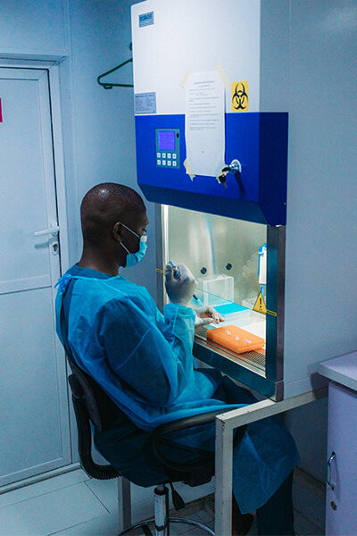 Staff performing PCR test